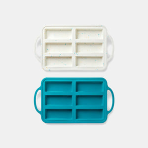 Two piece baking tray set by PlanetBox in white (with confetti) and teal