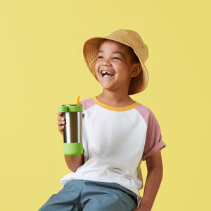 Lifestyle photo of child holding waterbottle