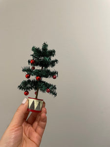 Maileg Miniature Christmas Tree in hand for scale